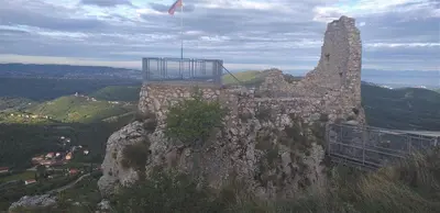 a building on top of a rocky mountain at Relax Črni Kal 3 in Črni Kal