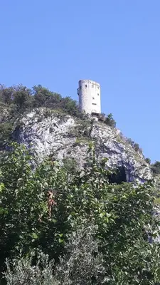 a castle on top of a hill with trees at Relax Črni Kal 3 in Črni Kal
