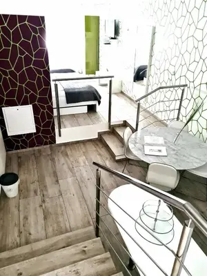 a bathroom with a glass table and a mirror at AZUR ROOMS LJUBLJANA in Ljubljana