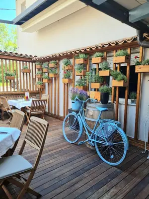 a blue bike parked on a wooden deck at AZUR ROOMS LJUBLJANA in Ljubljana