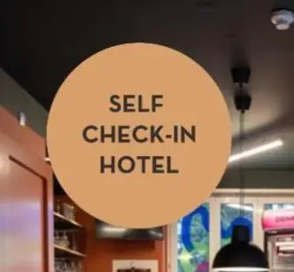 a sign that reads self check in a hotel at AZUR ROOMS LJUBLJANA in Ljubljana