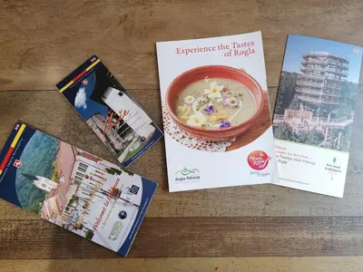 a table topped with books and a bowl of cereal at Hiša Žičanka in Loče pri Poljčanah