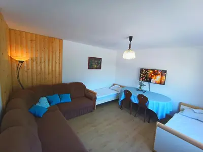 a living room with a couch and a table at Hiša Žičanka in Loče pri Poljčanah