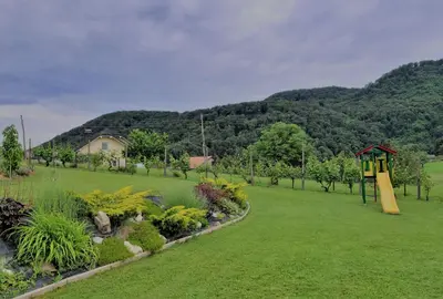 a park with a playground and a play structure at Hiša Žičanka in Loče pri Poljčanah