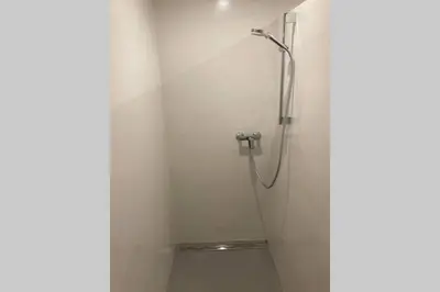 a shower stall in a bathroom with a toilet at Huge BBQ Garden 1, Basement app Two Bathrooms, AC, Free Parking in Ljubljana