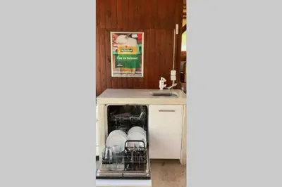a kitchen with a sink and a dishwasher at Huge BBQ Garden 1, Basement app Two Bathrooms, AC, Free Parking in Ljubljana