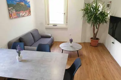 a living room with a couch and a table at The Villa in Ljubljana