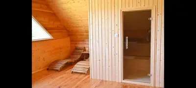 a room with a glass door in a cabin at Ranč Stojnšek in Rogaška Slatina