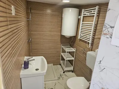 a bathroom with a sink and a toilet at River Houses Ljubljanica in Ljubljana