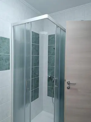 a shower with a glass door in a bathroom at Studio Maki in Bled