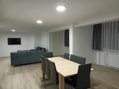 a room with a table and chairs and a couch at APARTMAJI KISILAK in Rogašovci