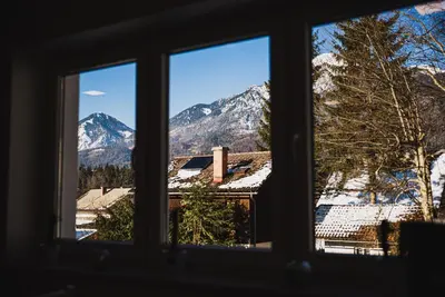 a view from a window of a snowy mountain at Apartments Rozalija in Preddvor