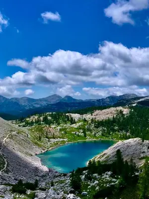 a view of a blue lake in the mountains at Two Panorama Apartments in Bovec