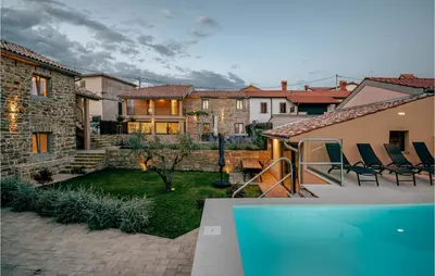 a house with a backyard with a swimming pool at Beautiful Home In Skofije in Plavje