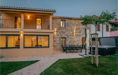 a villa with a swimming pool and a house at Beautiful Home In Skofije in Plavje