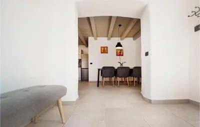 a dining room with a table and chairs at Beautiful Home In Skofije in Plavje