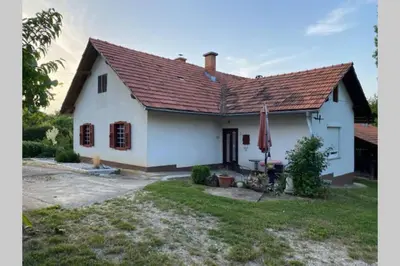 a white house with a red roof at Živahna hiša in Sveti Jurij ob Ščavnici