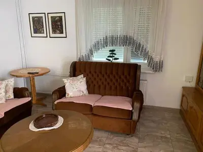 a living room with a couch and a table at Živahna hiša in Sveti Jurij ob Ščavnici