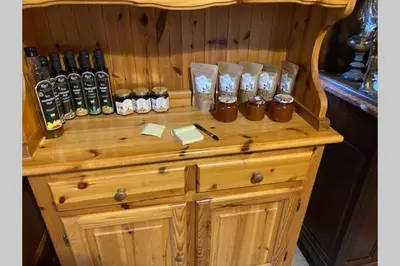 a wooden stand with bottles on top of it at Živahna hiša in Sveti Jurij ob Ščavnici