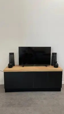 a flat screen tv sitting on top of a cabinet at Simba Apartment B in Smarjeske Toplice