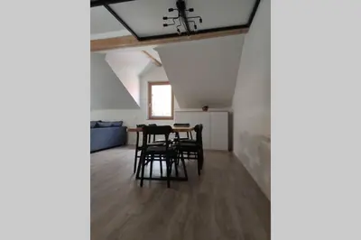 a dining room with a table and chairs at Bovec Loft apartment in Bovec
