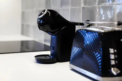a toaster sitting on top of a kitchen counter at Vila Slavc, cosy apartment near the lake in Bled