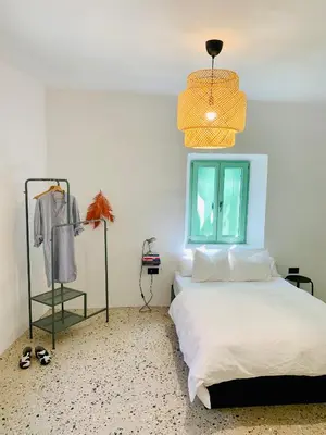 a bedroom with a bed and a window at Samson and the Lilo in Vipava