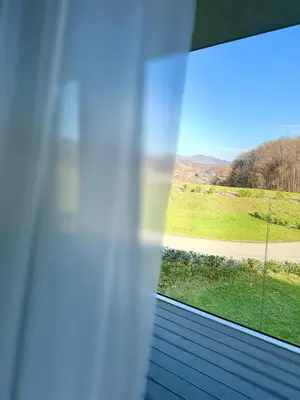 a window with a view of a field at Villa Tatjana in Rogaška Slatina