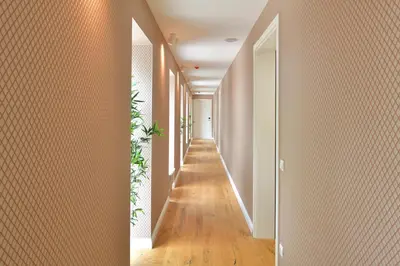 a hallway with orange walls and wooden floors at Villa Tatjana in Rogaška Slatina