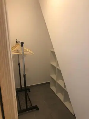 a room with a table and a shelf in a room at Holiday House Zlačka Gorca in Pristava pri Mestinju