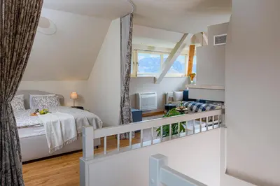 a small bedroom with a bed and a window at Villa Rory in Bled