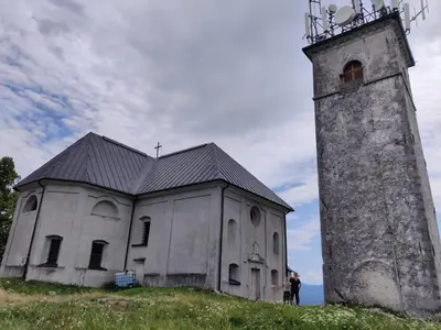 an old building with a tower on top of a hill at Amazing apartment in Stari Trg pri Ložu
