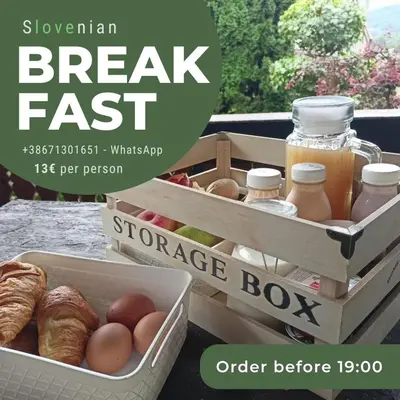 a advertisement for breakfast fast with a crate of eggs and bread at Rock Apartments in Bohinjska Bela