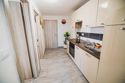 a kitchen with a sink and a counter top at CUDERLAND -CUKR in Kobarid