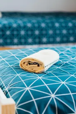 a towel sitting on top of a blue tiled floor at Apartment Sneznik in Stari Trg pri Ložu