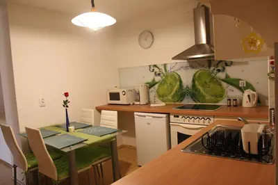 a kitchen with a table and a counter top at Dream Apartment Brglez in Bohinjska Bela
