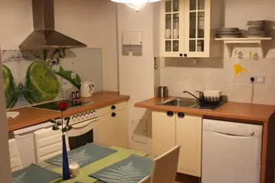 a kitchen with a table with a vase on it at Dream Apartment Brglez in Bohinjska Bela