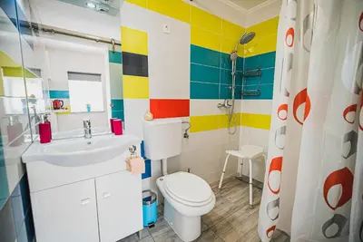 a bathroom with a toilet and a sink at CUDERLAND STUDIO KURNIK in Kobarid