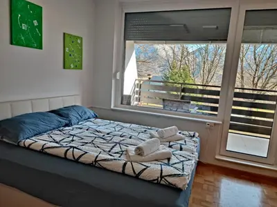 a bedroom with a bed with towels on it at Studio Kaninska vas in Bovec