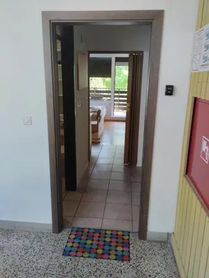 a hallway with a colorful mat on the floor at Studio Kaninska vas in Bovec