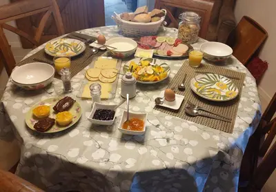 a table with plates of food on top of it at B&B Margarita in Cerkovna
