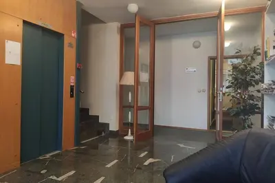 a room with a hallway with a glass door at Studio apartment 