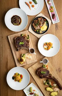 a table with plates of food on top of it at Spa Suite Dobrna - Terme Dobrna in Dobrna