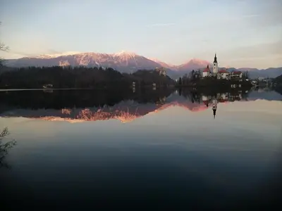 a church on an island in the middle of a lake at Freya in Lesce