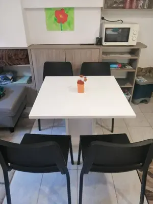 a white table and two chairs in a kitchen at Freya in Lesce