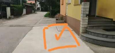 an orange painting of a tv on the side of a street at Freya in Lesce