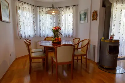 a dining room with a table and chairs at Villa Toni in Bled