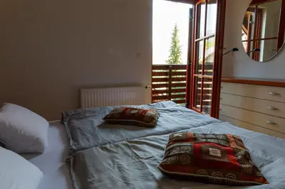 a bedroom with a bed with two pillows on it at Villa Toni in Bled