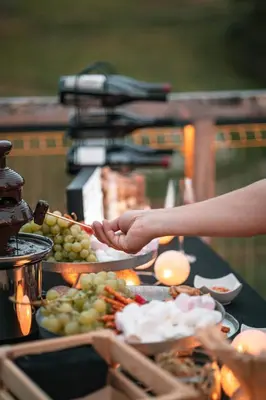 a table with a bunch of plates of food at Nesting Resort - Homestead SONČNI RAJ in Maribor