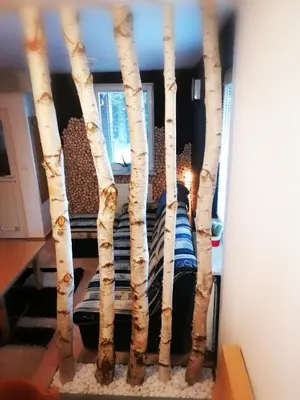 a bed made out of birch trees at Rogla - Apartma ROŽLE in Vitanje